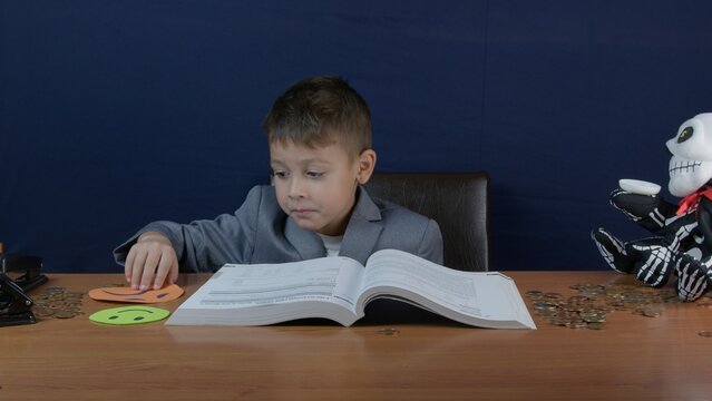 A young boy dressed formally, engrossed in a study activity at a desk, surrounded by unique objects with striking details. Vibrant and curious ambiance adds intrigue to this conceptual setting.