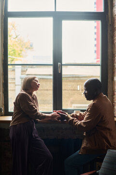 Discussing Matters Near Large Loft Window