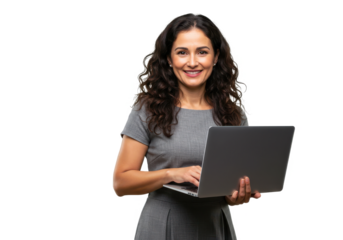 A confident woman with wavy dark brown hair, wearing a gray dress, holding a laptop and smiling warmly isolated on transparent, White background