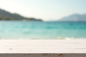 Fototapeta premium White wooden table top on blurred sea or ocean, white sand, mountains and clear sky, sunny day light background. side view, place for montage and showing products. Travel and vacation concept