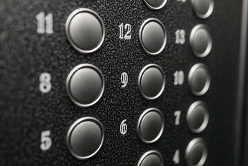 numbered floor buttons in elevator of multi-storey building