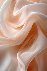 Obraz premium Soft, flowing peach-colored silk fabric with delicate folds and smooth texture, creating an elegant and luxurious aesthetic with a sense of movement and lightness