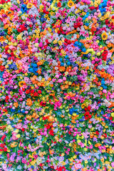 Blooming, a mural of artificial flowers in infinite shades