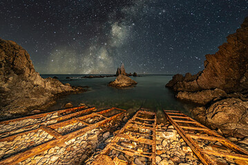 The Sirens Reef is a set of rock formations that emerge vertically from the Mediterranean Sea within the Cabo de Gata Natural Park in Almeria.