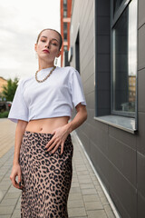 Confident Young Woman in Urban Fashion .Street Style with Leopard Print Skirt