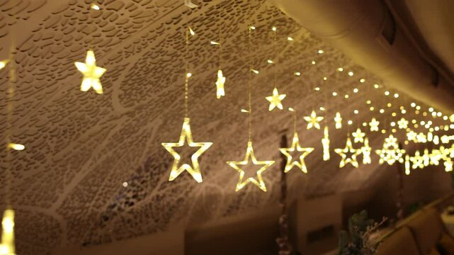 decoration of garlands in the shape of a star in a restaurant for Christmas