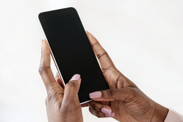 Modern Smartphone With Black Blank Screen In Hands Of Unrecognizable Black Lady, Mockup Image