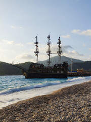 beautiful ships and boats are moored near the shore
