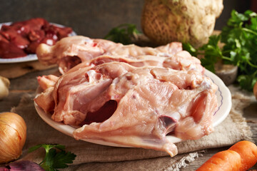 Fresh chicken backs, liver and vegetables - Ingredients for bone broth or soup