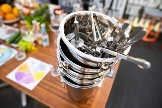 metal ice bucket on bar counter with ice scoop tool - Powered by Adobe