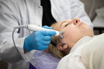 close-up of a girl's face at a cosmetologist during treatment procedures