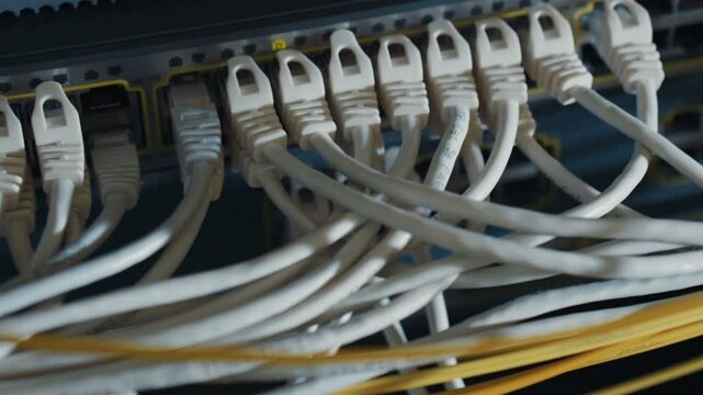 Techical engineer administrator electronic concept moving from right to left shot of server equipment localhost mining farm bitcoin, cables switches ethernet internet lights ports electronic elements