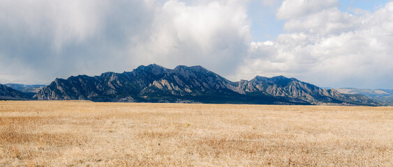Colorado mountain range over an open field