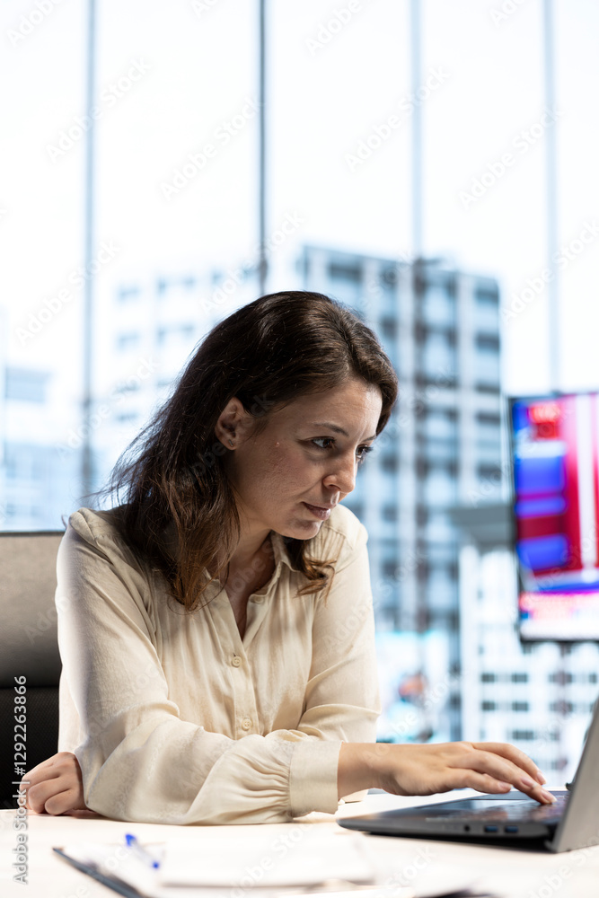 Poster ambitious focused entrepreneur examines enterprise performance metrics, using data driven analytics 