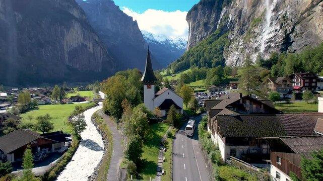 Beautiful aerial footage of Lauterbrunnen, a Swiss Alps valley with stunning cliffs, Staubbach and Tr&uuml;mmelbach Falls. A cable car from Stechelberg leads to Schilthorn, offering breathtaking views.