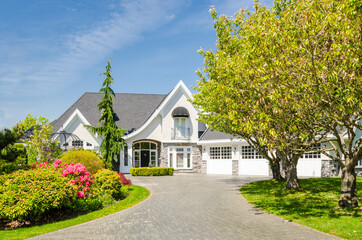 Two story luxury house with beautiful summer  landscape in Vancouver, Canada, North America. Day time on June 2024.