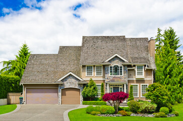 Two story luxury house with beautiful summer  landscape in Vancouver, Canada, North America. Day time on June 2024.