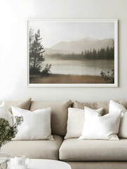 californian style bungalow of a lounge room beige couch with white cushions above the couch hangs a landscape canvas with a white frame lived in and morning light.jp