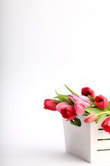 8 march bouquet of red and pink tulips in a white wooden box vertical for instagram story