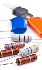 Various electronic components laid out on a white surface for educational purposes