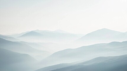 Serene Misty Landscape with Soft Rolling Hills and Mountains
