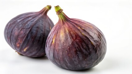 Two ripe figs on white background