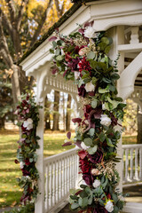 Closeup of beautiful outdoor floral wedding archway and gazebo