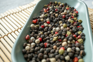 black pepper in a  bowl macro shot