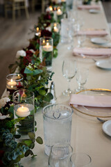 Beautiful purple rose and candlelight wedding table decorations