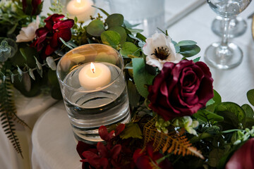Beautiful purple rose and candlelight wedding table decorations