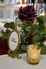 Beautiful purple rose and candlelight wedding table decorations
