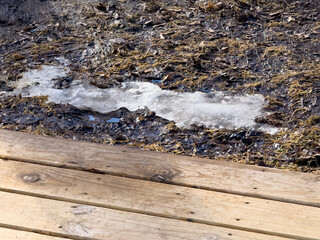 Snow on the ground by the deck