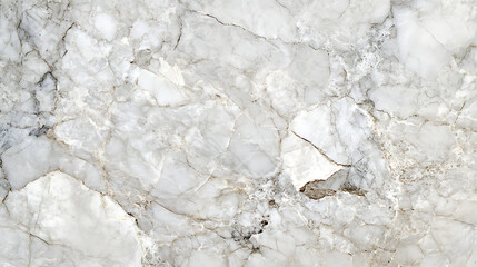A white marble wall with a few cracks and a few small pieces missing