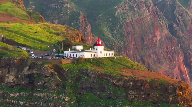 Exploring the stunning cliffs and lighthouse of Madeira during golden hour