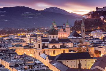 Sunset view of Salzburg, Austria, featuring Salzburg Cathedral and Hohensalzburg Fortress