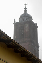 The belltower of an old church in Tlatlauquitepec, Puebla, Mexico.