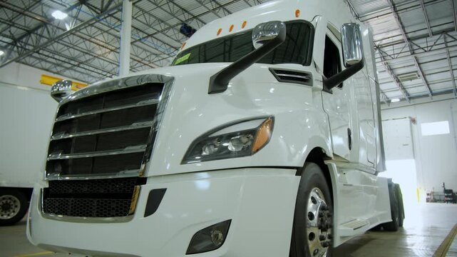 The white truck at the repair shop, Various devices and semi truck in the repair shop. close-up view. stable view.