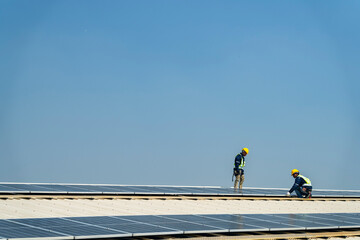 team of professionals installs solar panels, ensuring energy efficiency and sustainable development. The image represents green energy, eco-conscious solutions, and future solar power technology.