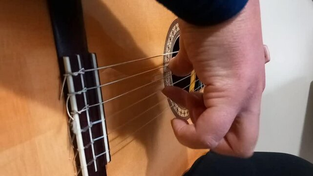 Play double arpeggio with flamenco guitar close up