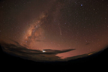A breathtaking view of the Milky Way galaxy sprawling across the night sky, capturing the beauty of...