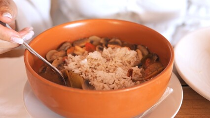 Tom yum with rice blends spicy broth tangy lime fresh herbs and tender grains Rich flavors soak into rice creating perfect balance of heat sourness and authentic Thai taste Asian cuisine concept