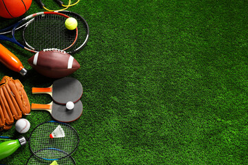 Different sports equipment on artificial grass, flat lay. Space for text