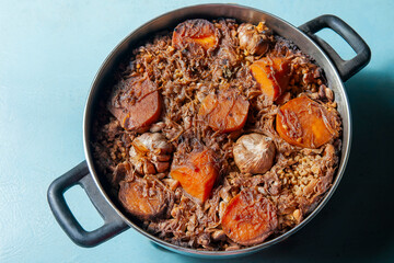 Delicious sephardic oriza with sweet potatoes, garlic, and spelt in a pot
