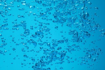 Many water bubbles on blue background, closeup