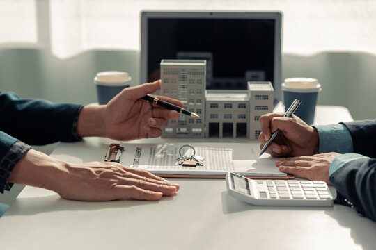 home insurance agent Signing a contract to buy and sell a house, renting a residence, property insurance, keys, house, mortgage, real estate, close-up photo