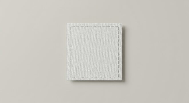 White fabric patch, square textile label, blank clothing tag, minimalist design, off-white background, clean stitching, simple texture, garment detail, soft lighting