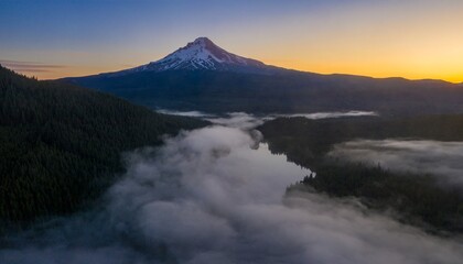 Misty morning view of Mount Hood, Oregon, with fog over Trillium Lake. Peaceful landscape.  Oregon, United States