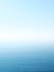Obraz premium Hazy Horizon Over the Ocean with Soft Blues and Greens Reflecting in the Water
