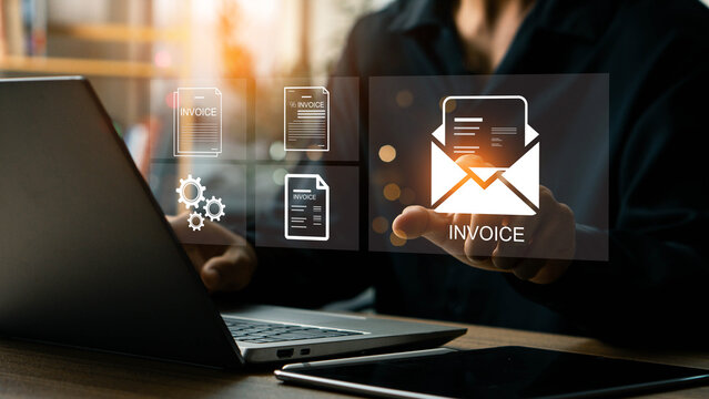E-Invoice and Digital billing concept, Businessman using laptop to manage electronic statements on virtual screen. E-tax, Digital receipt, Online invoice processing and tax accounting solutions. - Powered by Adobe