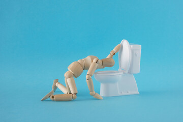 トイレで嘔吐する人